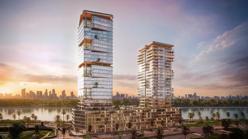 Radiant Atrium Towers with the canal and city skyline at sunset
