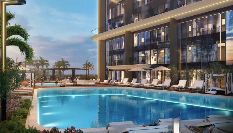 Resort-style swimming pool lined with sun loungers
